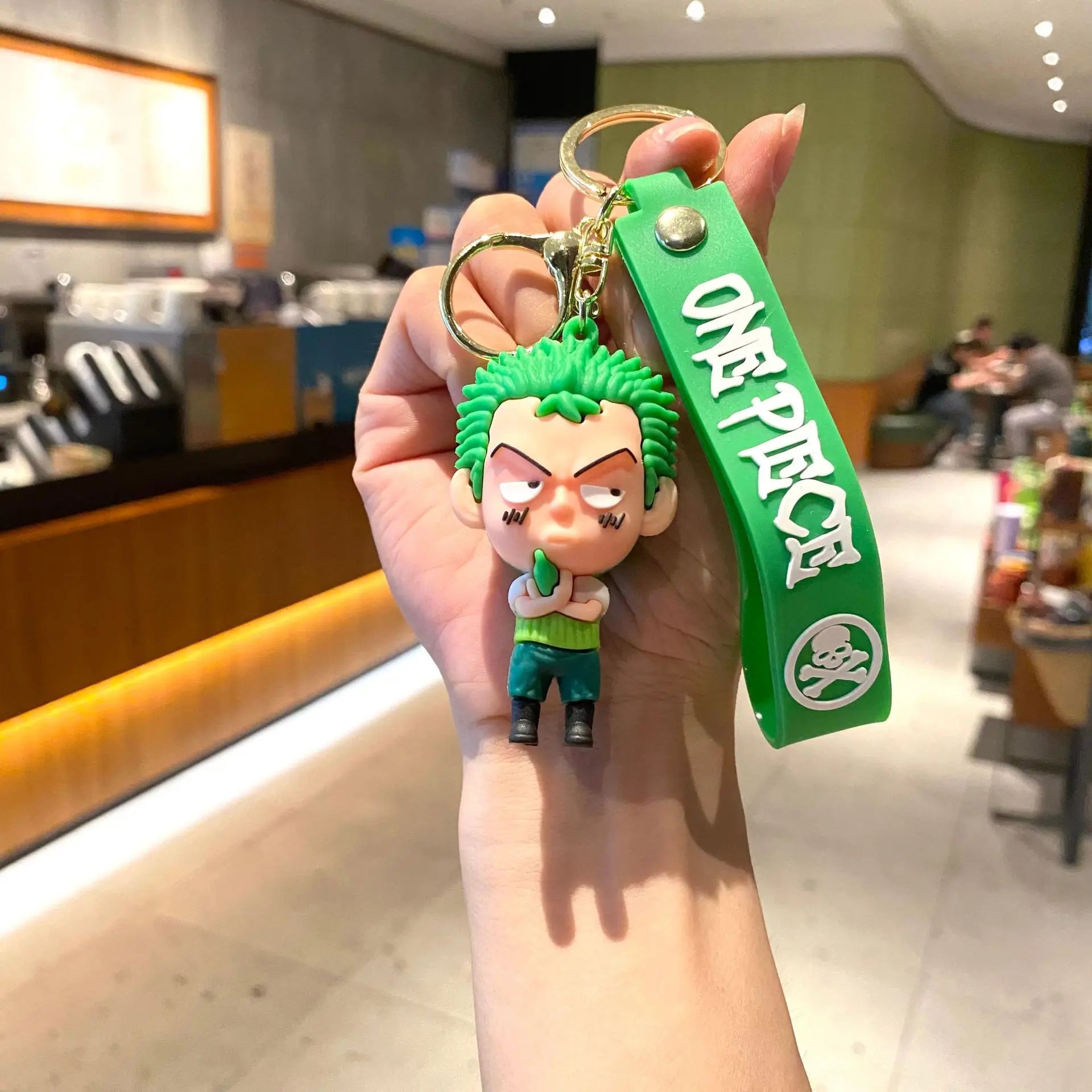 Porte-clés One Piece Zoro fond vert cartoon